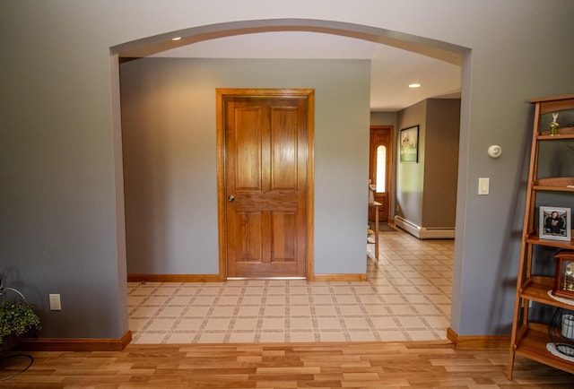 32 Ridge Rd, Marshfield, ME 04654 - hallway with arched walkways, a baseboard heating unit, and recessed lighting