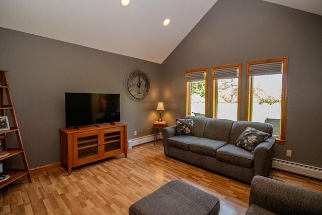 32 Ridge Rd, Marshfield, ME 04654 - living room featuring a baseboard radiator, high vaulted ceiling, light wood-type flooring, and recessed lighting