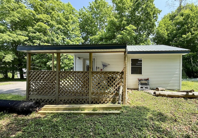 755 Main St, Calais, ME 04619 - rear view of house with a metal roof