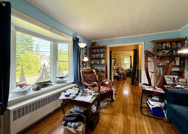 755 Main St, Calais, ME 04619 - sitting room featuring radiator, ornamental molding, and wood-type flooring