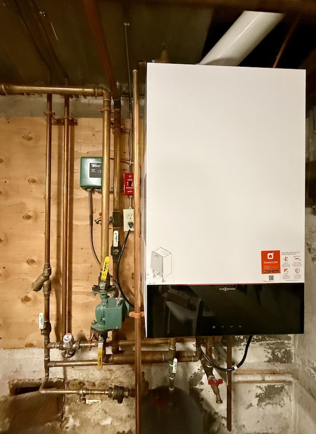 755 Main St, Calais, ME 04619 - utility room with tankless water heater