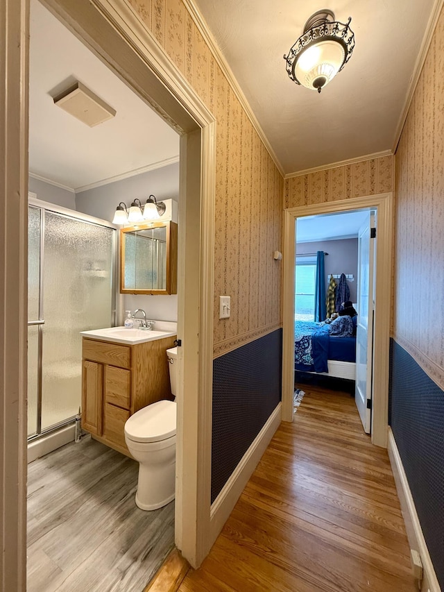 755 Main St, Calais, ME 04619 - bathroom with wallpapered walls, wood finished floors, a shower stall, vanity, and baseboard heating