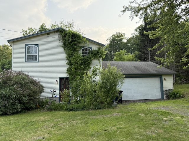 211 Hinckley Hill Rd, Carmel, ME 04419 - view of side of home with a garage and a yard