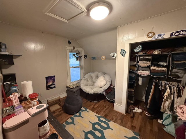 58 Elm St, Old Town, ME 04468 - bedroom featuring attic access, wood finished floors, and vaulted ceiling