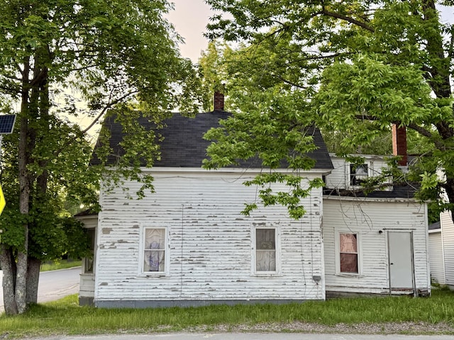 58 Elm St, Old Town, ME 04468 - back of property with a chimney