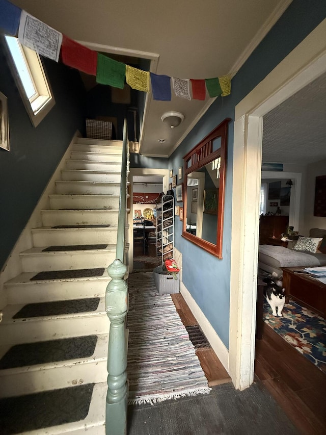 58 Elm St, Old Town, ME 04468 - stairs featuring wood finished floors and ornamental molding