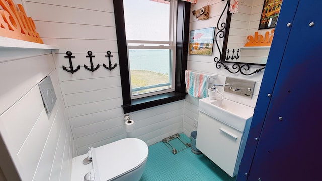 552 Port Rd, Machiasport, ME 04655 - bathroom featuring vanity, plenty of natural light, tile patterned flooring, and wood walls