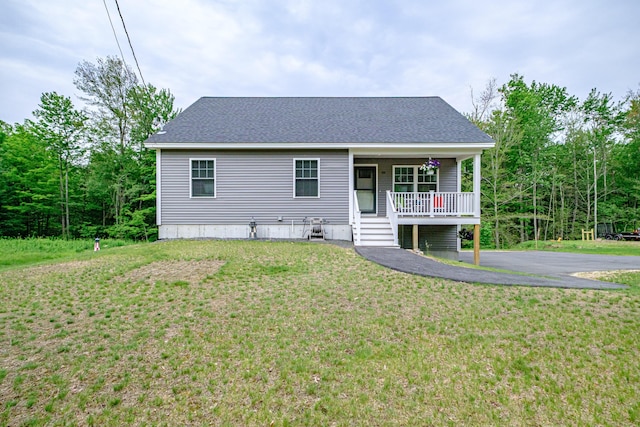 144 Ridley Rd, Sanford, ME 04073 - view of front of home featuring covered porch and a front lawn