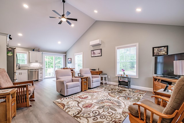 144 Ridley Rd, Sanford, ME 04073 - living room featuring high vaulted ceiling, ceiling fan, light wood-type flooring, a wall mounted AC, and recessed lighting