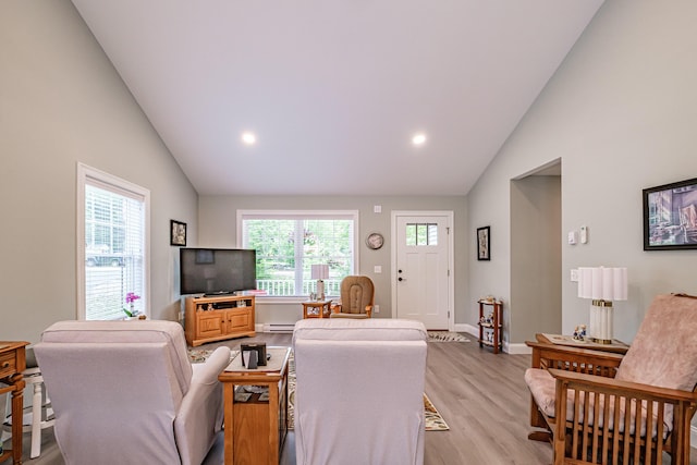 144 Ridley Rd, Sanford, ME 04073 - living room featuring light wood finished floors, baseboard heating, recessed lighting, and high vaulted ceiling