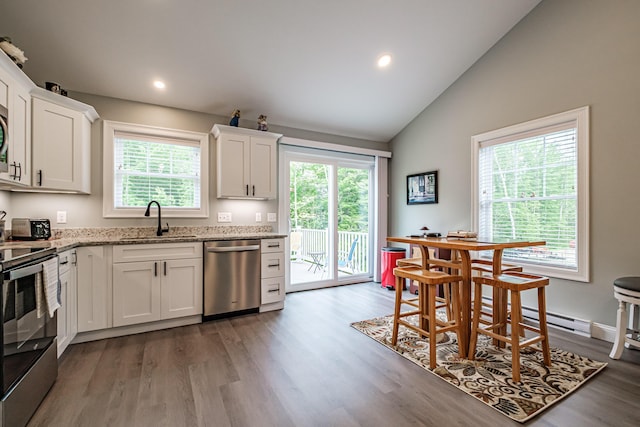 144 Ridley Rd, Sanford, ME 04073 - kitchen with appliances with stainless steel finishes, light stone countertops, wood finished floors, white cabinets, and recessed lighting