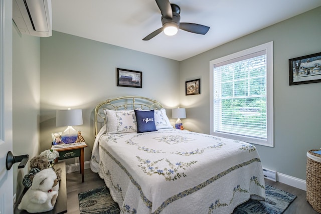 144 Ridley Rd, Sanford, ME 04073 - bedroom featuring a wall mounted AC, wood finished floors, and a ceiling fan