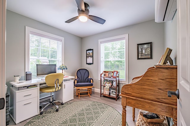 144 Ridley Rd, Sanford, ME 04073 - office space with a wall mounted air conditioner, ceiling fan, a baseboard heating unit, and light wood-style floors