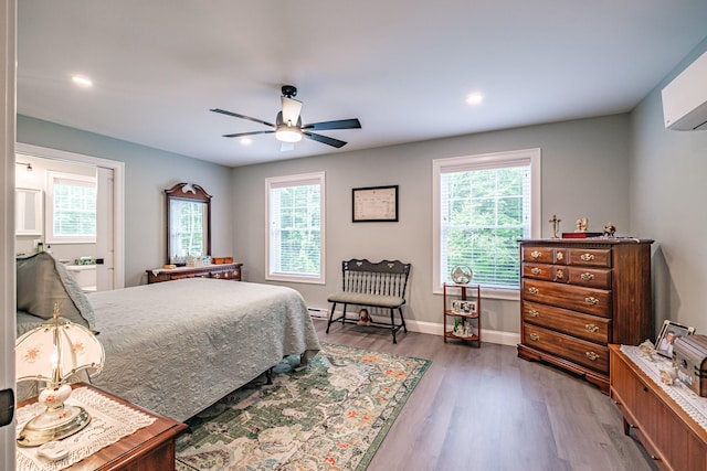 144 Ridley Rd, Sanford, ME 04073 - bedroom with wood finished floors, a wall mounted AC, recessed lighting, and a ceiling fan