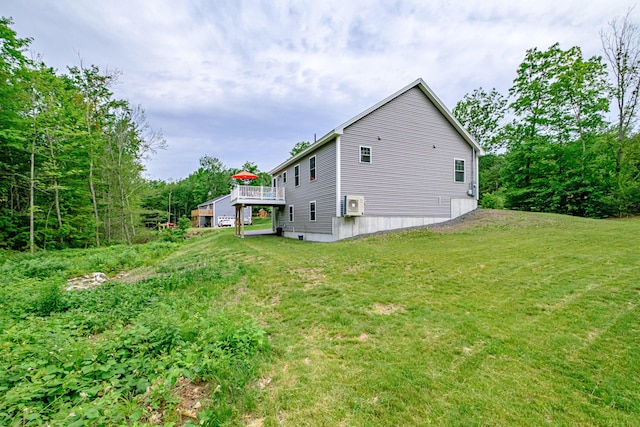 144 Ridley Rd, Sanford, ME 04073 - view of side of home featuring a lawn and a wooden deck