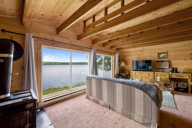 19 Davis Ln, Burnham, ME 04922 - carpeted living room featuring wood walls, a wooden ceiling with exposed beams, and an AC wall unit