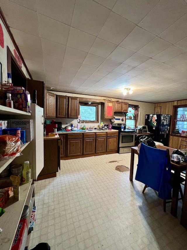 358 Swain Rd, Rumford, ME 04276 - kitchen featuring electric stove, freestanding refrigerator, light floors, and light countertops