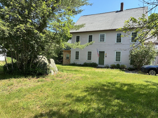 6 Paddy Ln, Franklin, ME 04634 - view of front of property featuring a chimney, a front yard, and a shingled roof