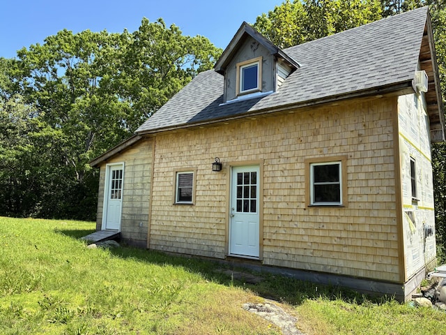 6 Paddy Ln, Franklin, ME 04634 - rear view of house with roof with shingles and a yard