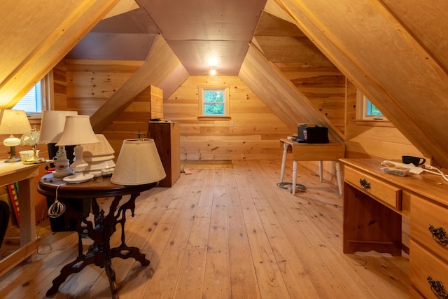 6 Paddy Ln, Franklin, ME 04634 - additional living space with wooden walls, lofted ceiling, light wood-style flooring, and plenty of natural light