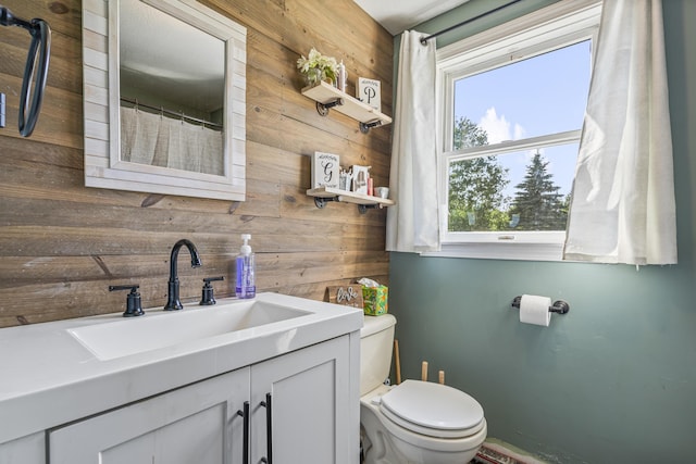104 Chick Rd, Lebanon, ME 04027 - bathroom featuring wood walls and vanity
