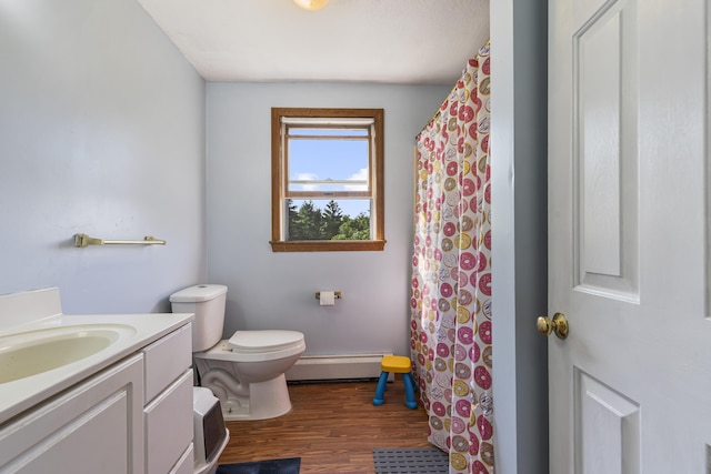 104 Chick Rd, Lebanon, ME 04027 - bathroom featuring baseboard heating, vanity, wood finished floors, and curtained shower