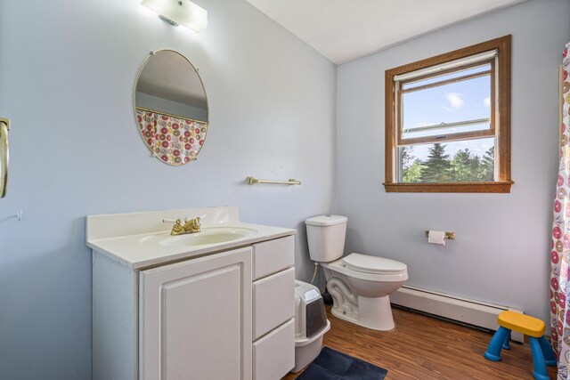 104 Chick Rd, Lebanon, ME 04027 - bathroom featuring a baseboard radiator, vanity, and wood finished floors