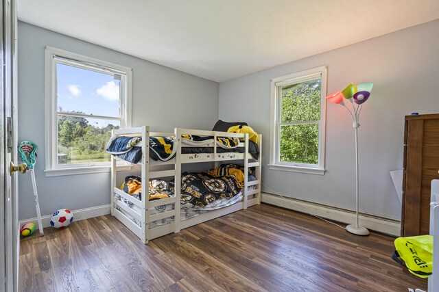 104 Chick Rd, Lebanon, ME 04027 - bedroom featuring a baseboard heating unit and wood finished floors