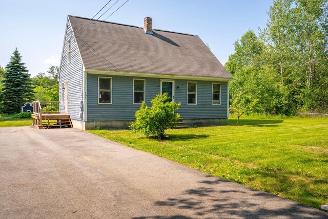 104 Chick Rd, Lebanon, ME 04027 - back of house with a yard, a chimney, and roof with shingles