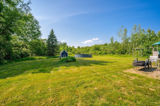 104 Chick Rd, Lebanon, ME 04027 - view of green lawn with an outdoor structure