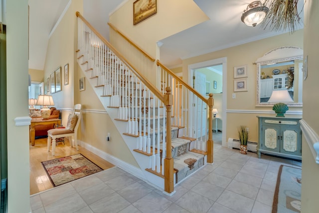 86 Farragut Way Unit 86, Kennebunk, ME 04043 - staircase featuring tile patterned flooring, crown molding, a baseboard heating unit, and a chandelier