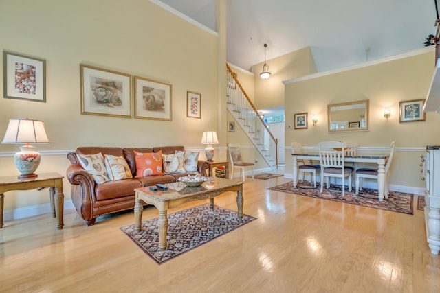 86 Farragut Way Unit 86, Kennebunk, ME 04043 - living room featuring stairway, wood finished floors, and a towering ceiling