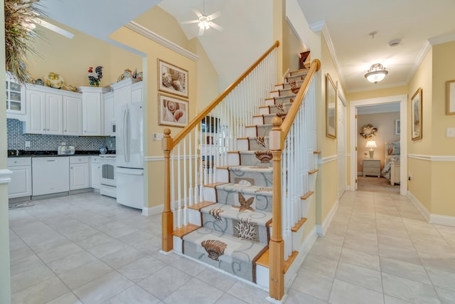 86 Farragut Way Unit 86, Kennebunk, ME 04043 - staircase featuring crown molding, ceiling fan, a towering ceiling, and tile patterned floors