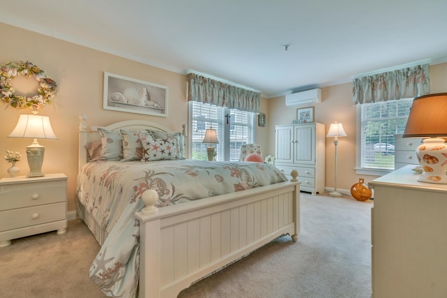 86 Farragut Way Unit 86, Kennebunk, ME 04043 - bedroom with a wall unit AC, light carpet, multiple windows, and crown molding