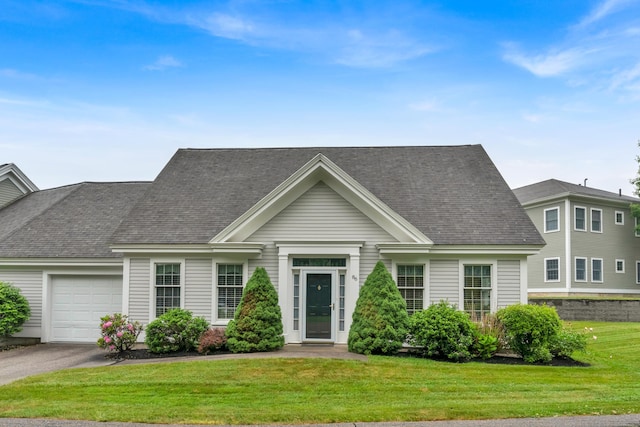 86 Farragut Way Unit 86, Kennebunk, ME 04043 - view of front facade with a garage, a front yard, a shingled roof, and asphalt driveway