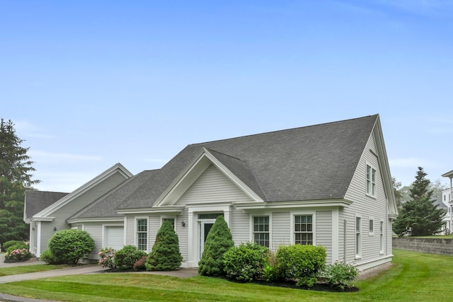 86 Farragut Way Unit 86, Kennebunk, ME 04043 - view of front facade featuring a front lawn and roof with shingles