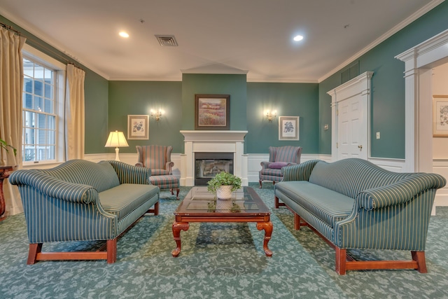 86 Farragut Way Unit 86, Kennebunk, ME 04043 - carpeted living area featuring crown molding, a decorative wall, a wainscoted wall, a fireplace, and recessed lighting
