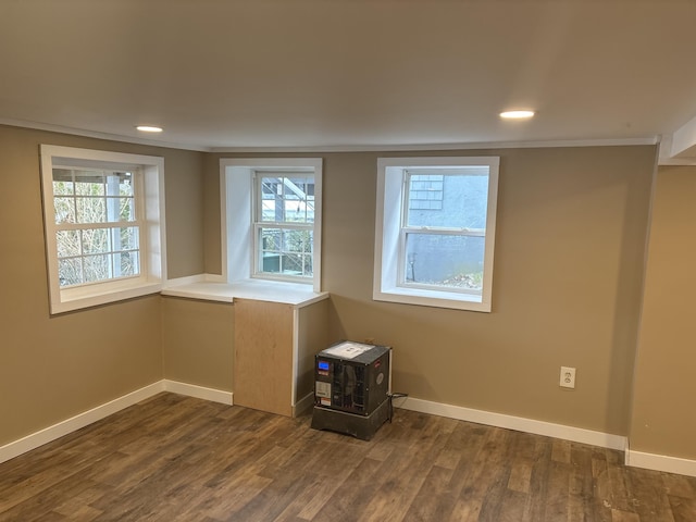23 Page Rd, Enfield, ME 04493 - empty room featuring dark wood-style floors, plenty of natural light, recessed lighting, and crown molding