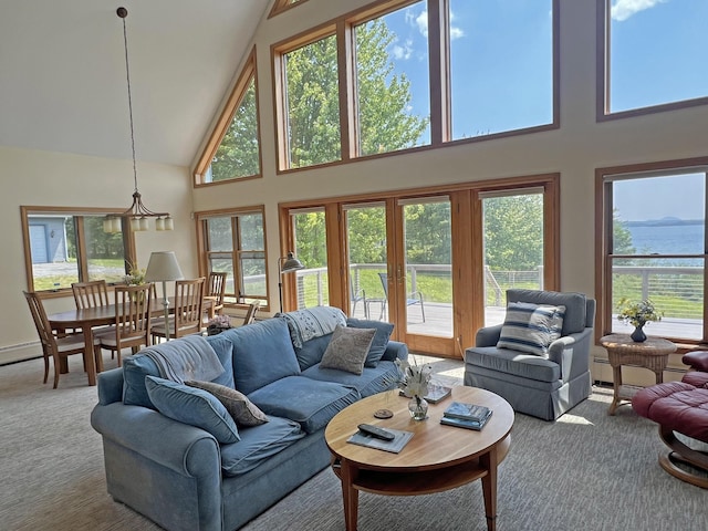 31 Deer Run, Lamoine, ME 04605 - living area with high vaulted ceiling, carpet, and plenty of natural light