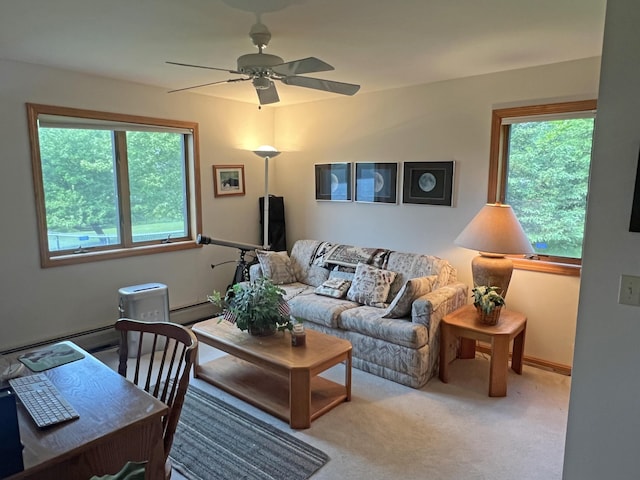 31 Deer Run, Lamoine, ME 04605 - carpeted living room with healthy amount of natural light, a ceiling fan, and a baseboard heating unit