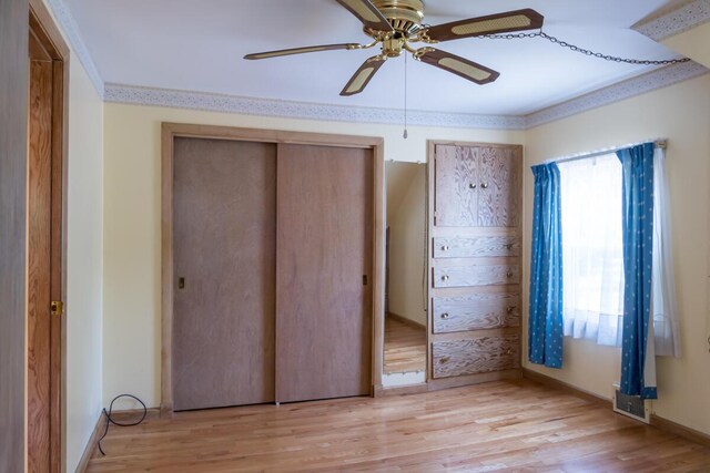 69 Garfield Rd, Auburn, ME 04210 - unfurnished bedroom featuring light wood-style floors, a closet, and ceiling fan