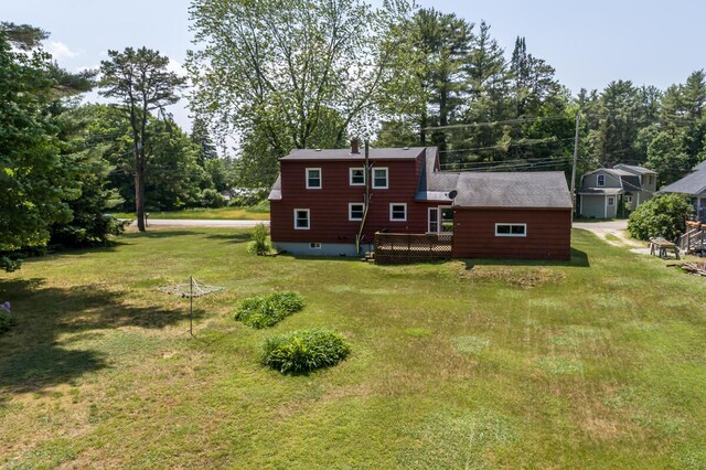 69 Garfield Rd, Auburn, ME 04210 - back of house featuring a lawn, a deck, and view of wooded area