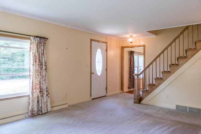 69 Garfield Rd, Auburn, ME 04210 - carpeted entrance foyer featuring stairs, baseboard heating, and crown molding