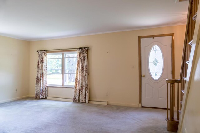 69 Garfield Rd, Auburn, ME 04210 - carpeted entrance foyer with healthy amount of natural light, crown molding, and a baseboard radiator
