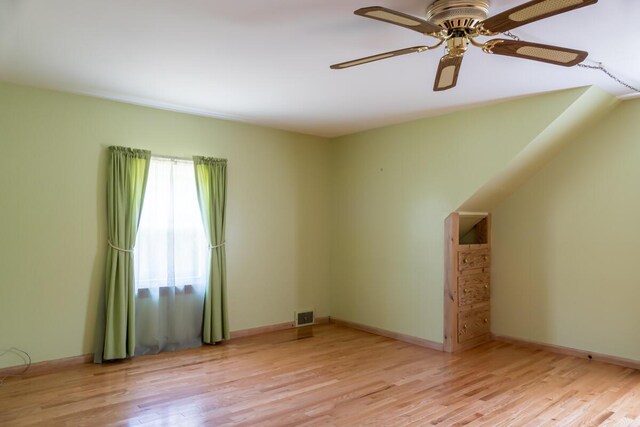 69 Garfield Rd, Auburn, ME 04210 - unfurnished living room featuring wood finished floors and ceiling fan