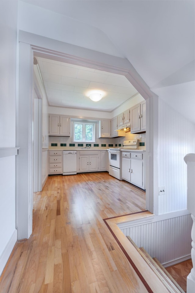 10 Dike Rd, Bath, ME 04530 - kitchen with white appliances, light countertops, light wood-style floors, under cabinet range hood, and white cabinets
