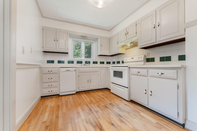 10 Dike Rd, Bath, ME 04530 - kitchen with white appliances, under cabinet range hood, light countertops, decorative backsplash, and light wood-type flooring