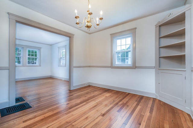 10 Dike Rd, Bath, ME 04530 - empty room with a chandelier and light wood-type flooring