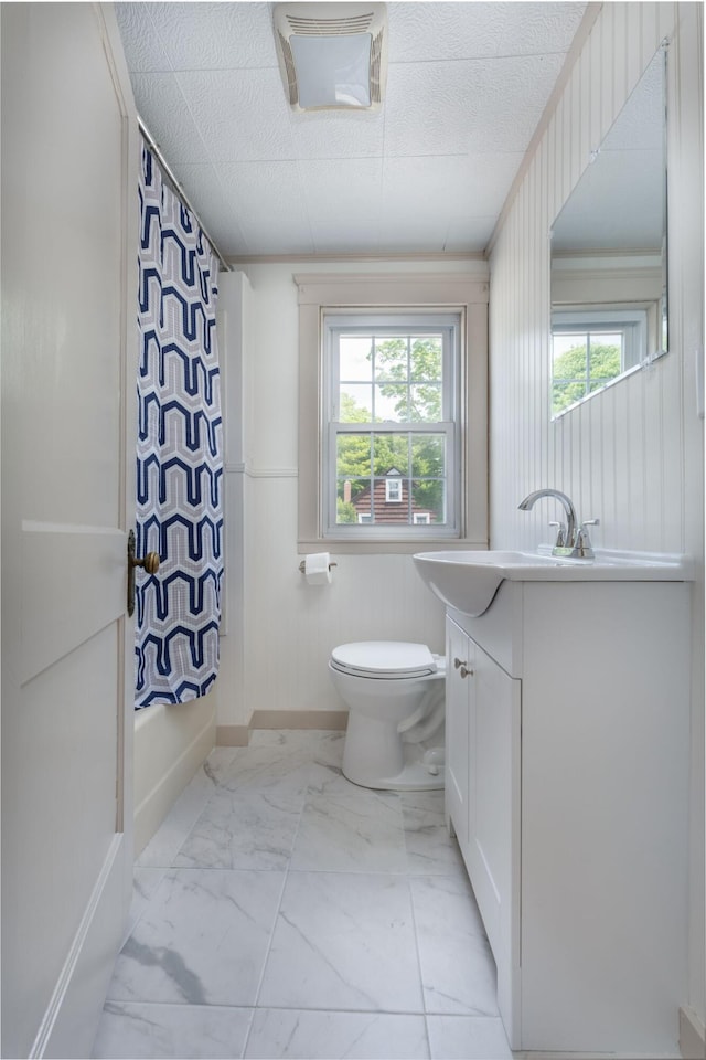 10 Dike Rd, Bath, ME 04530 - bathroom with vanity, marble finish flooring, plenty of natural light, and shower / bath combo with shower curtain