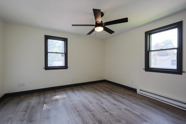 9 Jean St, Kittery, ME 03904 - unfurnished room featuring a baseboard radiator, wood finished floors, and a ceiling fan